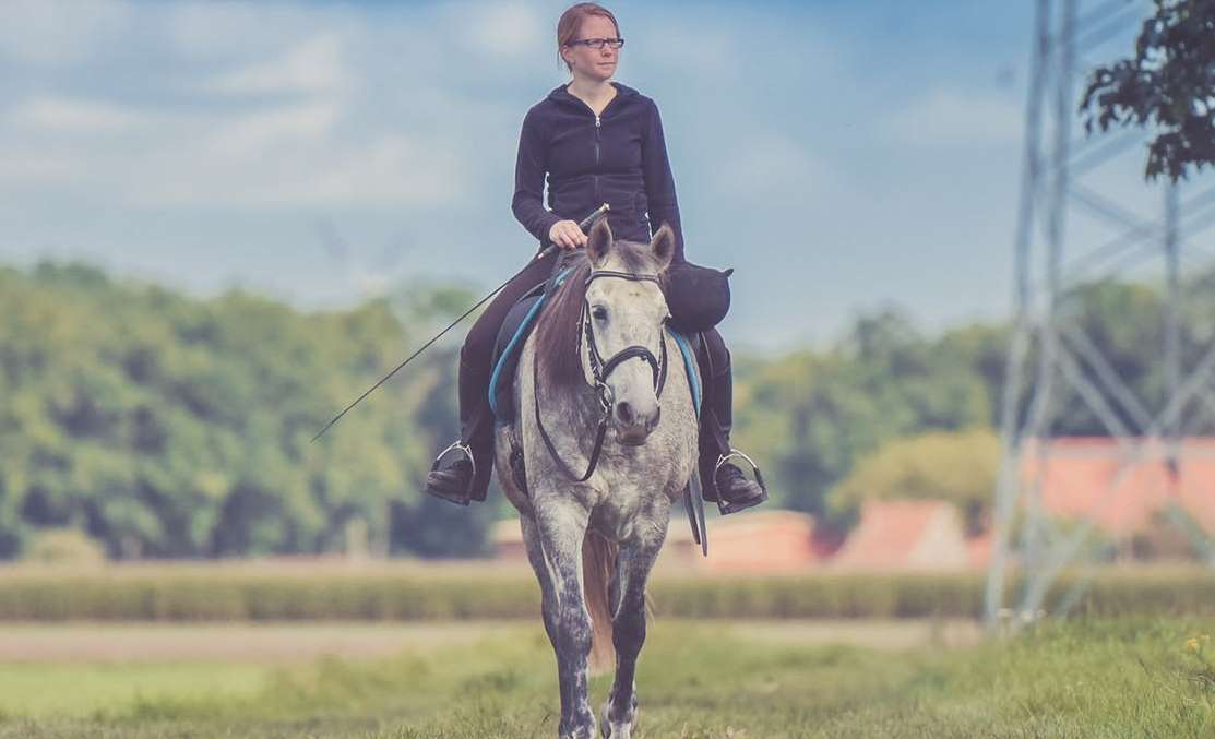 man riding horse